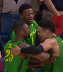 Jordan Bell, Elgin Cook, and Dillon Brooks celebrate.